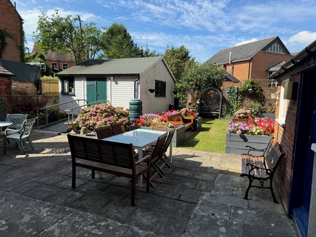 Lot: 110 - 5,000 SQ FT FREEHOLD TOWN CENTRE BUILDING WITH POTENTIAL - A Ground Level View of the Gardens Looking Away From the Building